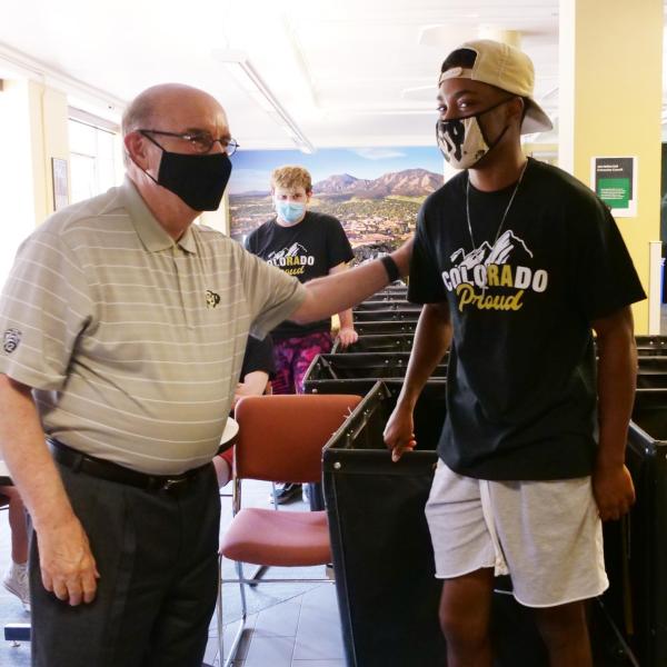 Chancellor Phil DiStefano greets parents, students and staff during a tour of Hallett Hall on the first day of Move-In on Monday, Aug. 16, 2021. (Photo by Glenn Asakawa/University of Colorado)