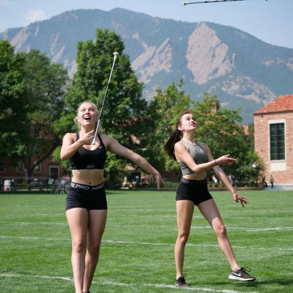 Golden Buff Marching Band baton twirlers practice at Farrand Field during Move-In on Tuesday, Aug. 17, 2021. (Photo by Glenn Asakawa/University of Colorado)