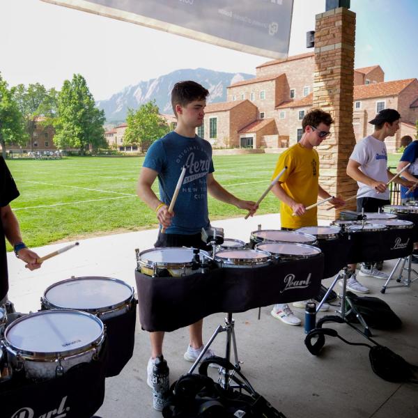 The Golden Buff Marching Band drum line practices at Farrand Field during Move-In on Tuesday, Aug. 17, 2021. (Photo by Glenn Asakawa/University of Colorado)
