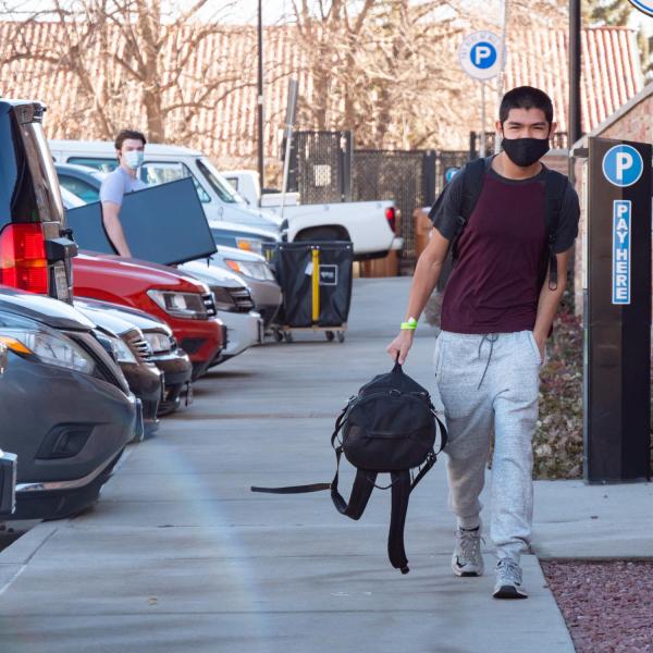 Fernando Gonzalez, a first year CU Boulder aerospace engineering student, returns to the Kittredge Central residence hall on Feb. 7, 2021. (Photo by Glenn Asakawa/University of Colorado)