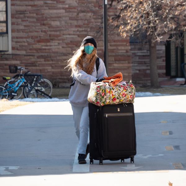 CU Boulder first year student Gigi Connor returns to her residence hall in the Kittredge complex on campus on Feb. 7, 2021. (Photo by Glenn Asakawa/University of Colorado)