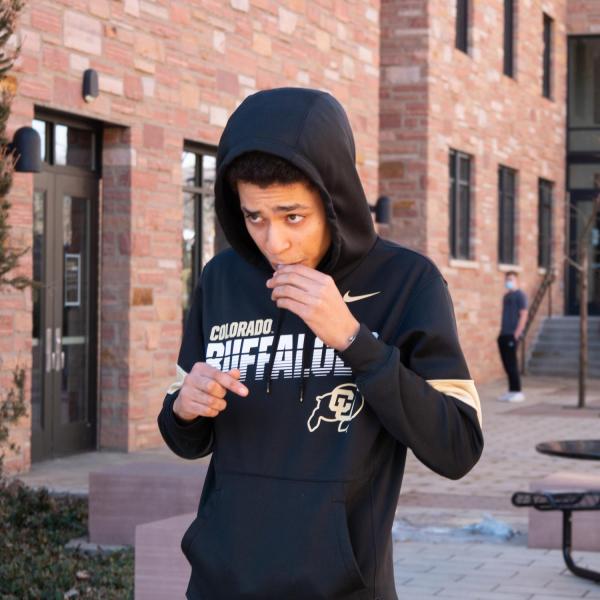 CU Boulder first year aerospace student Robert Batten of New York City provides his first COVID-19 test after moving back into the Kittredge complex on Feb. 7, 2021. (Photo by Glenn Asakawa/University of Colorado)