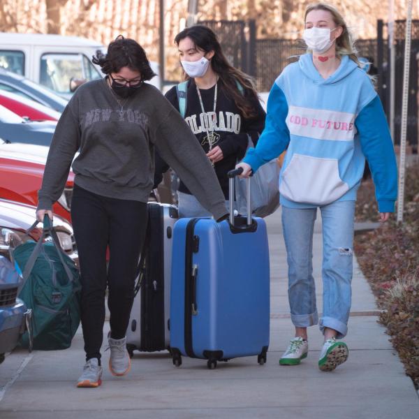 Students return to the Kittredge residence hall complex on Feb. 7, 2021, after studying remotely since the middle of January. (Photo by Glenn Asakawa/University of Colorado)