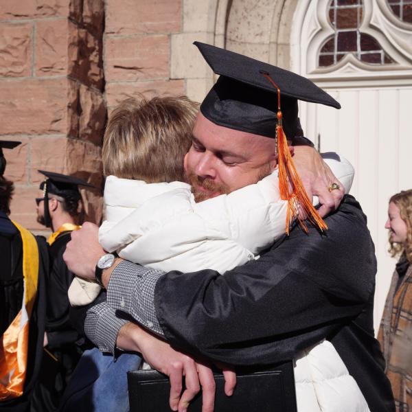 Graduates and families celebrating 2021 winter conferral. Photo by Patrick Campbell.