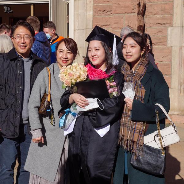 Graduates and families celebrating 2021 winter conferral. Photo by Patrick Campbell.
