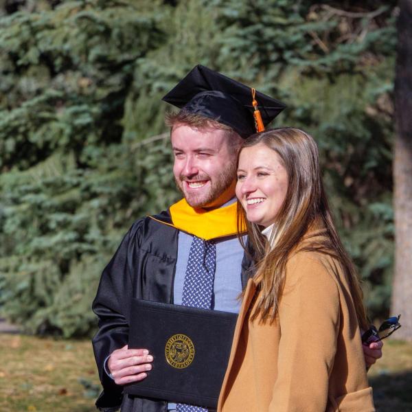 Graduates and families celebrating 2021 winter conferral. Photo by Patrick Campbell.