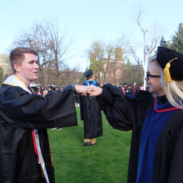 Students and faculty gather on the quad before processing to Folsom Stadium