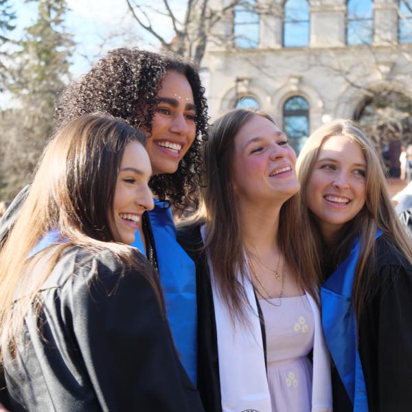 Students and faculty gather on the quad before processing to Folsom Stadium