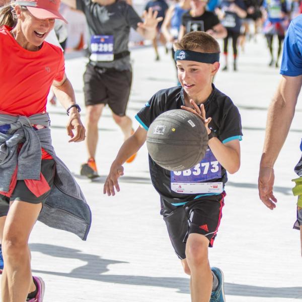 Participants finish up the race and celebrate at Folsom Field.