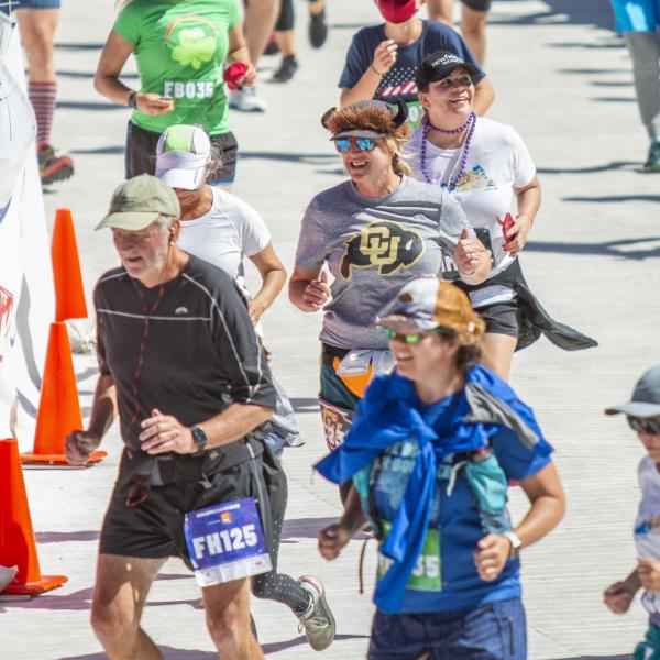 Participants finish up the race and celebrate at Folsom Field.