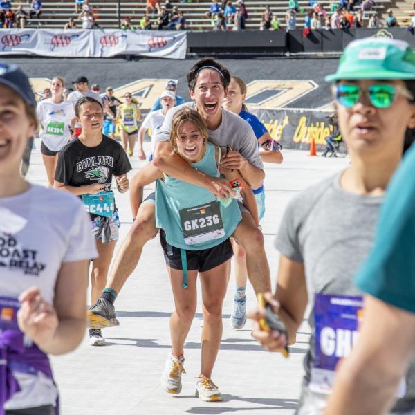 Participants finish up the race and celebrate at Folsom Field.