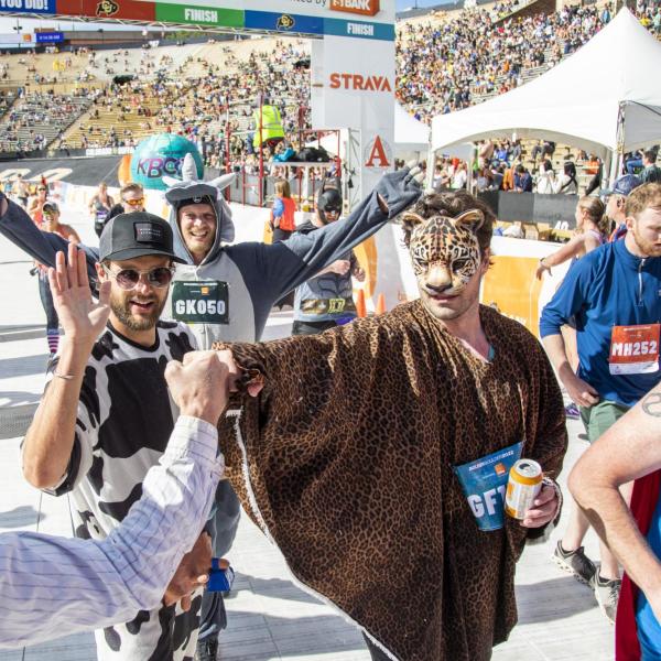 Participants finish up the race and celebrate at Folsom Field.