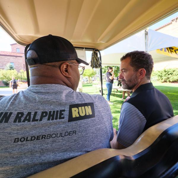 CU system President Todd Saliman greets volunteers during move-in
