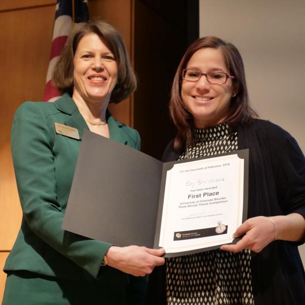 Paty Abril-Gonzalez (Holt), right, is congratulated by Dean/Vice Provost Ann Schmiesing for winning the first-place award for the Three Minute Thesis Competition. Photo by Casey A. Cass.