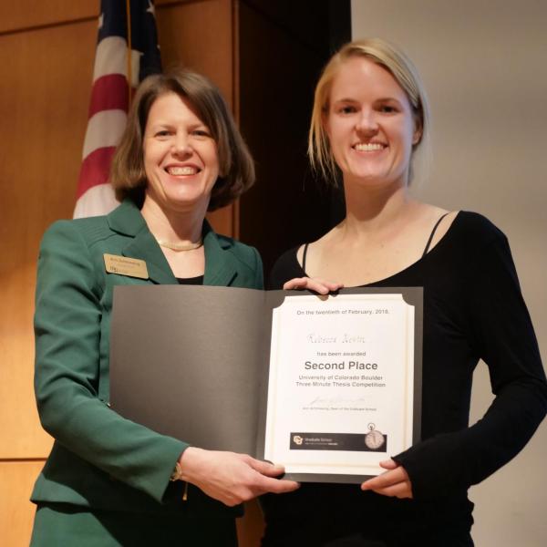 Rebecca Nevin, right, is congratulated by Dean/Vice Provost Ann Schmiesing for winning the second-place award for the Three Minute Thesis Competition. Photo by Casey A. Cass.
