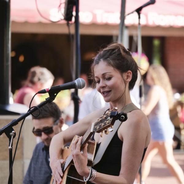 Musician plays at Bands on the Bricks on Pearl Street