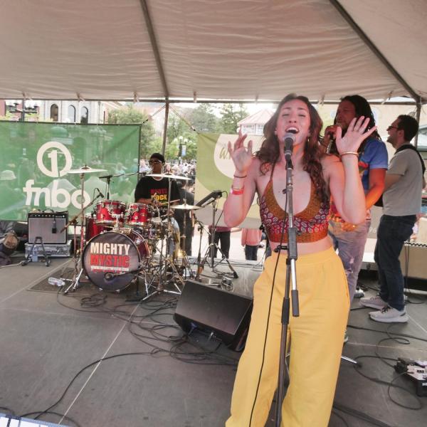 Singer performs on stage during the Bands on the Bricks event
