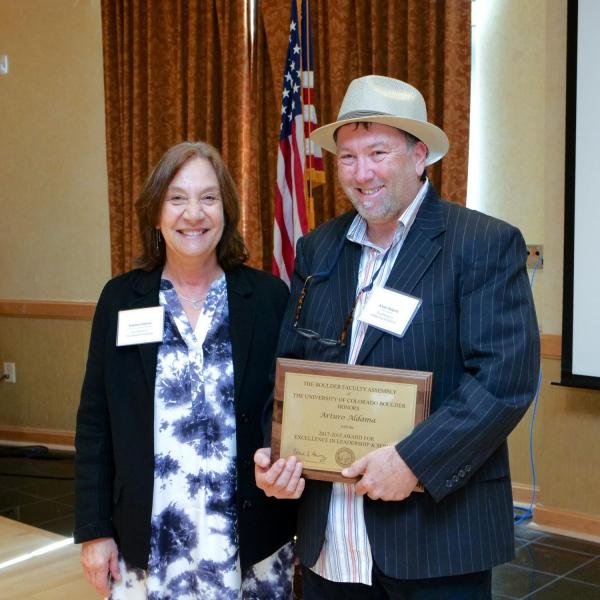 Leadership and Service Award Selection Committee Chair Andrea Feldman and recipient Arturo Aldama