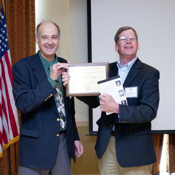 Research, Scholarly and Creative Work Award Selection Committee Chair Alastair Norcross and recipient