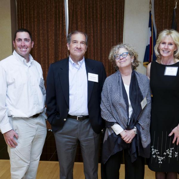 Research, Scholarly and Creative Work Award Selection Committee Chair Vicki Grove (far right) poses with award recipients (left to right) John Cassano, Russell Cropanzano, and Nan Goodman.