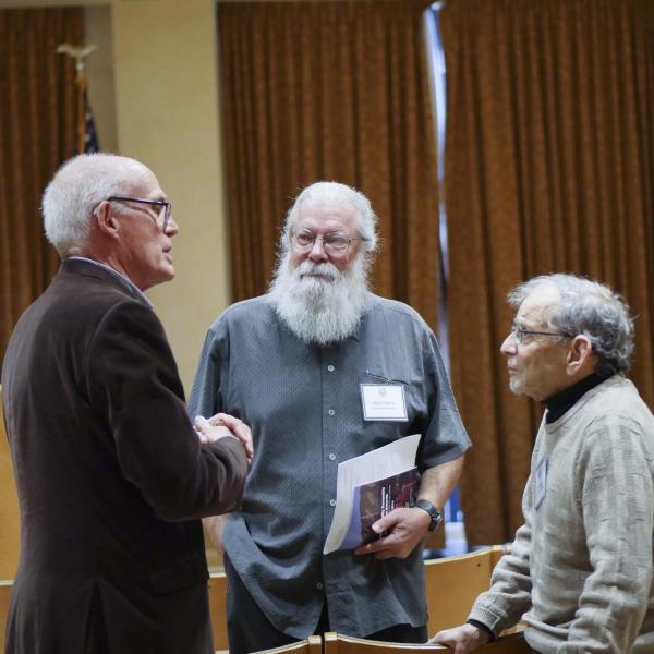 Teaching & Pedagogy Award Selection Committee Chair Adam Norris chats with colleagues during the 2019 BFA Excellence Awards & Reception.
