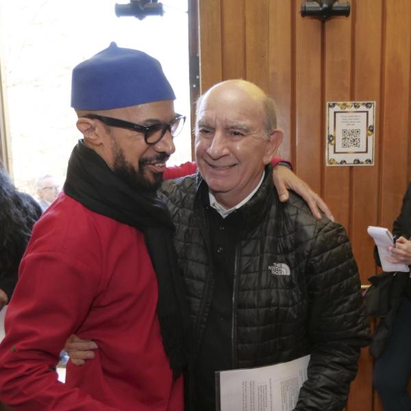 Director Reiland Rabaka and Chancellor Philip DiStefano embrace at the CAAAS grand opening. (Casey A. Cass/University of Colorado)