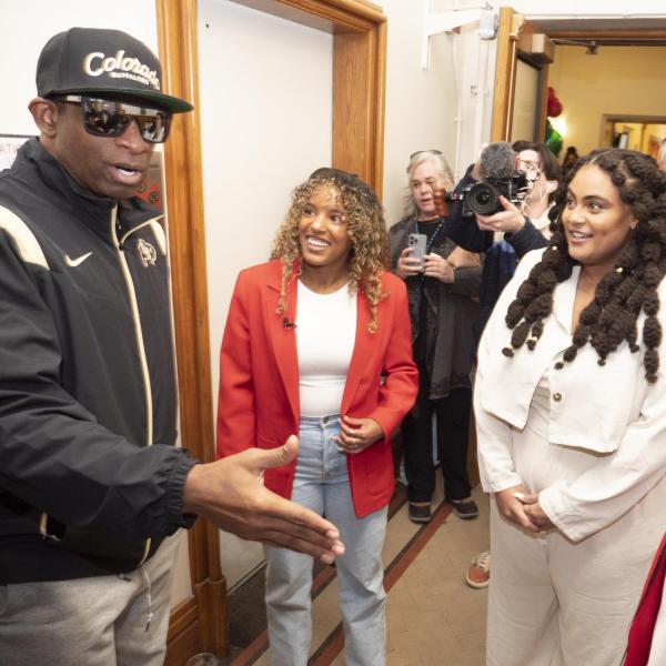 Deion "Coach Prime" Sanders talks with some of the CAAAS student founders. (Casey A. Cass/University of Colorado)