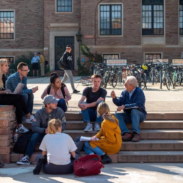 Students enjoy a warm fall day on campus. (Photo by Patrick Campbell/University of Colorado)