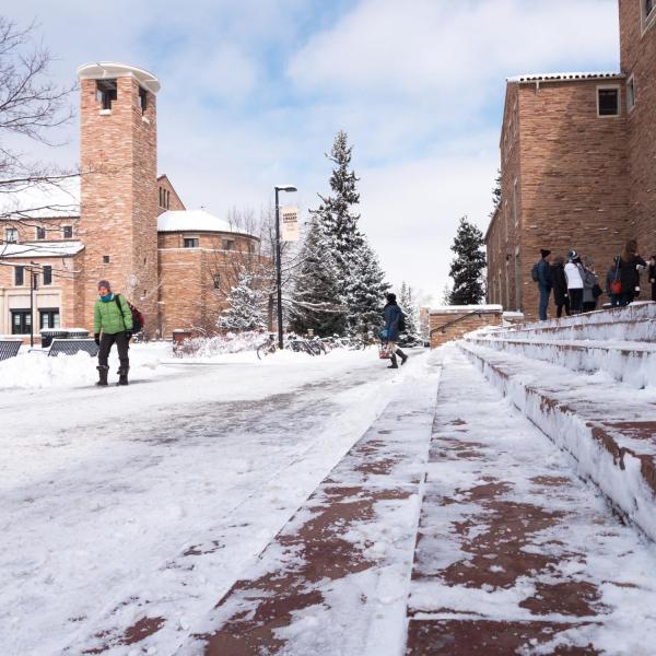 Campus community members trek across a snowy campus on Tuesday, Feb. 20. Photo by Patrick Campbell.