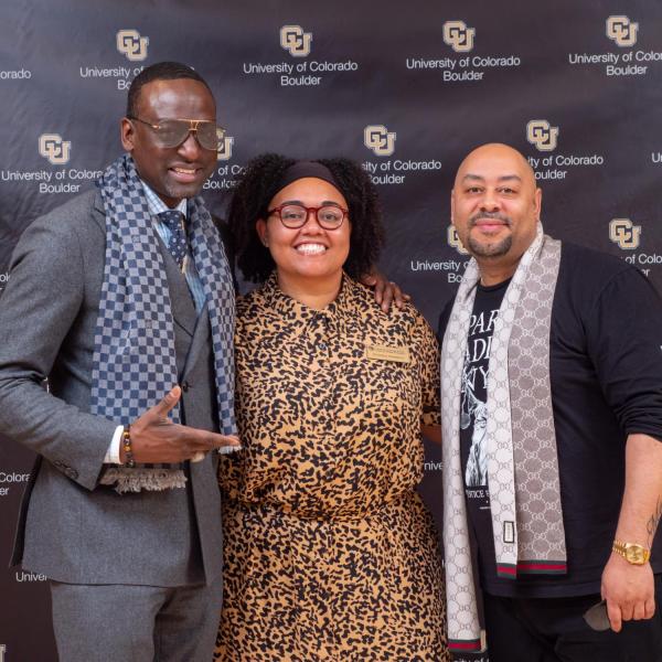 Yusef Salaam, right, and Raymond Santana, two of the five "Exonerated Five" who were wrongly convicted of a brutal attack on a Central Park jogger, pose with Christina Chambers, Coordinator for Cultural Programs Center for Student Involvement, after an informal Cultural Events Board talk at the University Memorial Center on March 10. 2020. (Photo by Glenn Asakawa/University of Colorado)