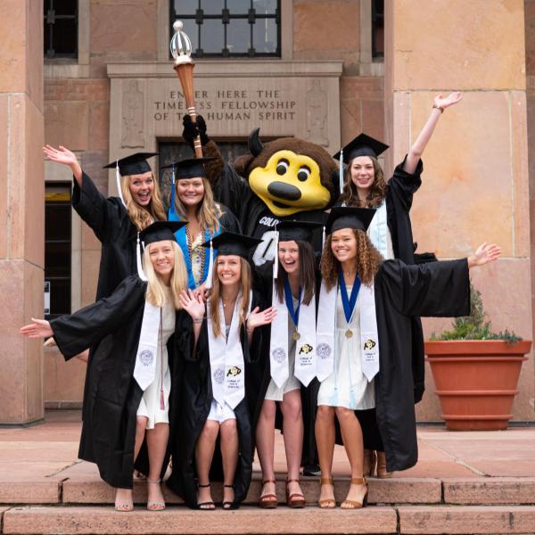 Chip, in regalia, joins others in celebrating 2021’s CU Boulder commencement ceremony. (Photo by Glenn Asakawa/University of Colorado)