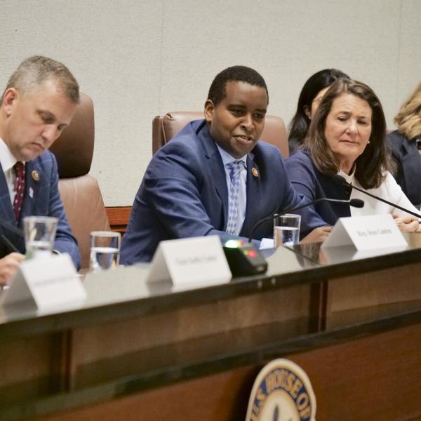 Representative Joe Neguse introduces Governor Jared Polis during the House Select Committee on the Climate Crisis hearing at the University of Colorado Boulder. (Photo by Casey A. Cass/University of Colorado)