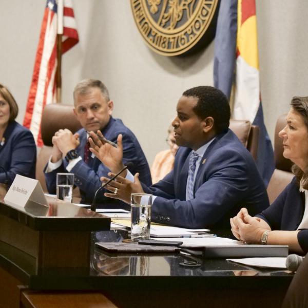 Representative Joe Neguse questions Governor Jared Polis during the House Select Committee on the Climate Crisis hearing at the University of Colorado Boulder. (Photo by Casey A. Cass/University of Colorado)