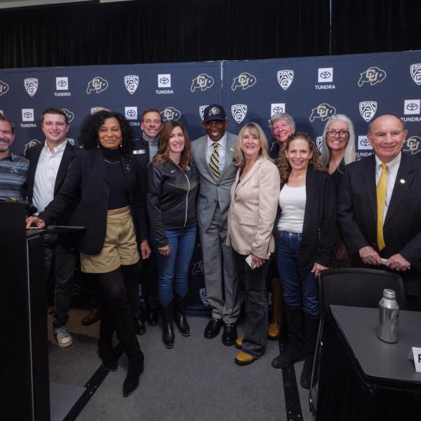 Sanders poses with CU Regents, President Todd Saliman and CU Boulder Chancellor Phil DiStefano during the press conference