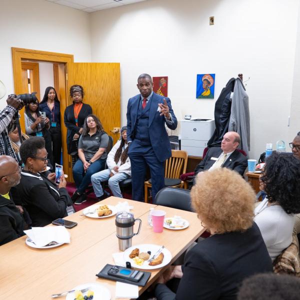 Deion Sanders speaks to members of the Colorado Black Caucus during a breakfast meeting