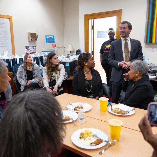 CU President Todd Saliman addresses members of the Colorado Black Caucus lawmakers during a breakfast meeting