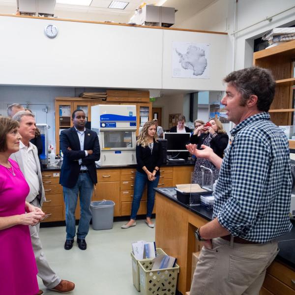 CIRES Fellow Noah Fierer leads a tour of lab during the congressional tour of CIRES. (Photo by Patrick Campbell/University of Colorado)