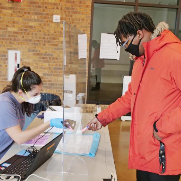 Allen Oden, a civil engineering major from Fort Bragg, North Carolina, takes a COVID-19 test at Williams Village at CU Boulder. (Photo by Casey A. Cass/University of Colorado)