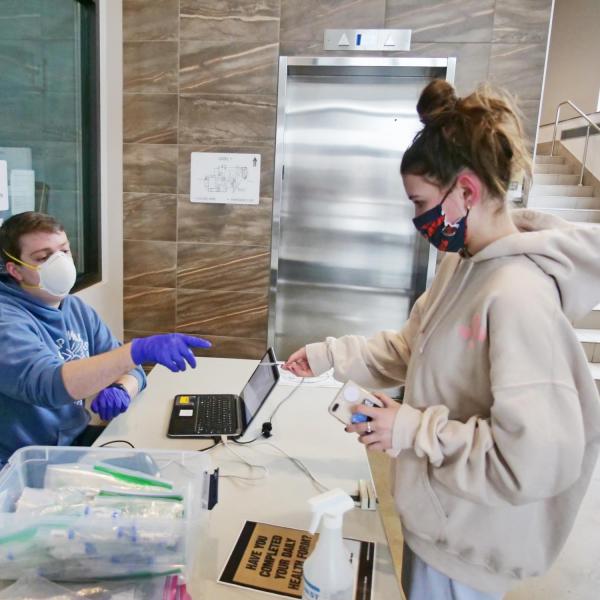 Mia Gallay, a psychology major from Chicago, takes a COVID-19 test at Williams Village at CU Boulder. (Photo by Casey A. Cass/University of Colorado)