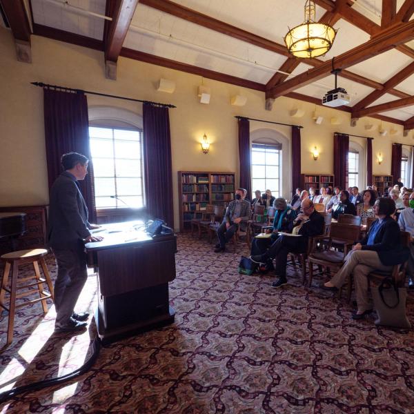 Professor Max Boykoff speaks during the EU visit.