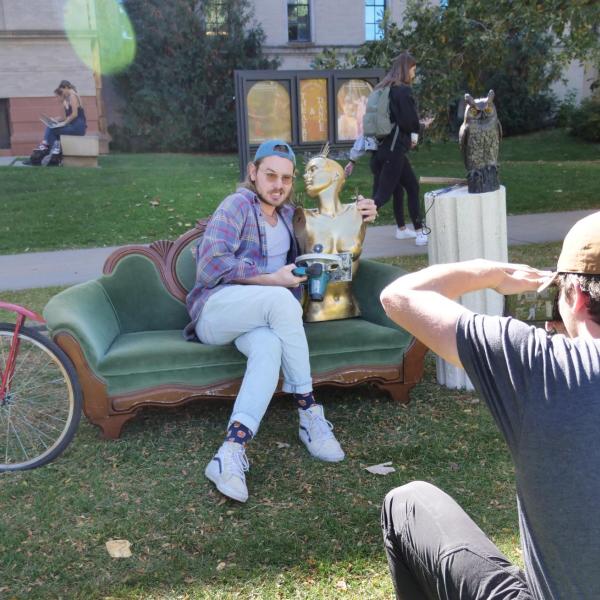 Campus community members pose for photos at the Sandbox photobooth near the Department of Theatre & Dance