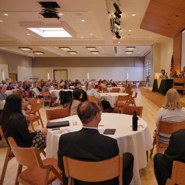 Attendees listen to a panel discussion in the Glenn Miller Ballroom