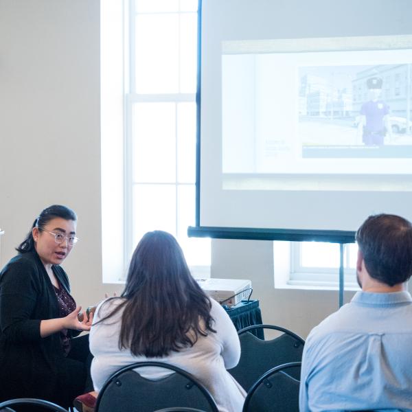 Woman gives presentation at DLAW 2017 session