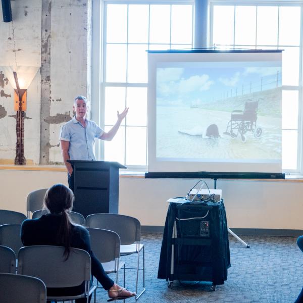 Man gives presentation at DLAW 2017 session