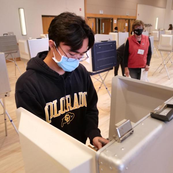 Joshua Vierra, a sophomore music cello performance major, votes at a polling place in the University Memorial Center at CU Boulder. (Photo by Casey A. Cass/University of Colorado)
