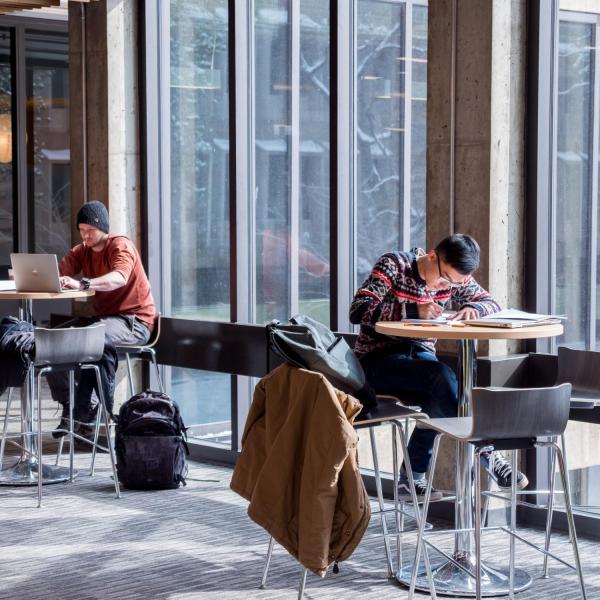 Students studying in the sunlight at the Engineering Center. Photo by Patrick Campbell.