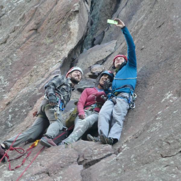 University of Colorado senior psychology major Esha Mehta, center, poses for a selfie with Paradox Sports Program Director Adam Fisher, left, and Ryan Pedersen while rock climbing in Eldorado Canyon near Boulder. Mehta is a blind competitive rock climber.