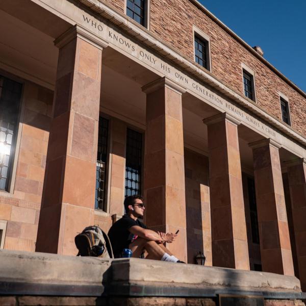 Students enjoy a warm fall day in the Norlin Quad. (Photo by Glenn Asakawa/University of Colorado)
