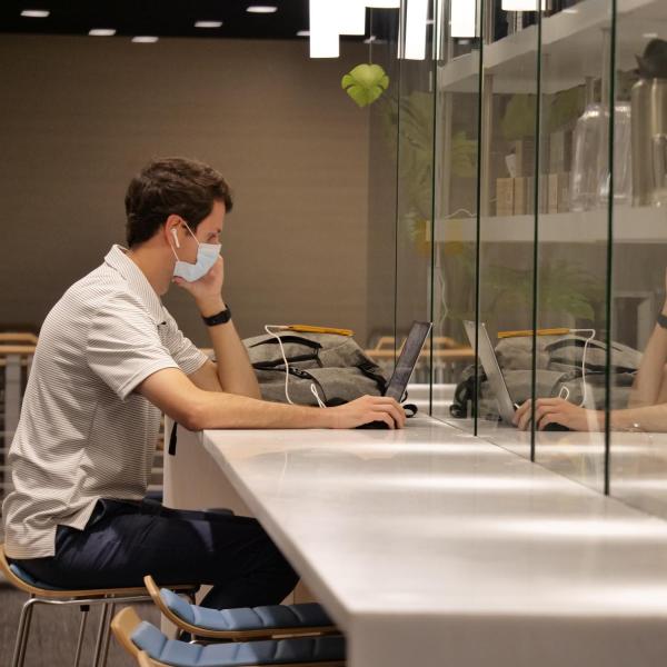 A student studies in the Caruso Innovation Hub Cafe in the Rustandy Building during fall 2021's first day of classes at CU Boulder. (Photo by Casey A. Cass/University of Colorado)