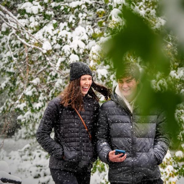 Students make their way to class during the first snowfall of the year on Oct. 10, 2019. (Photo by Patrick Campbell/University of Colorado)